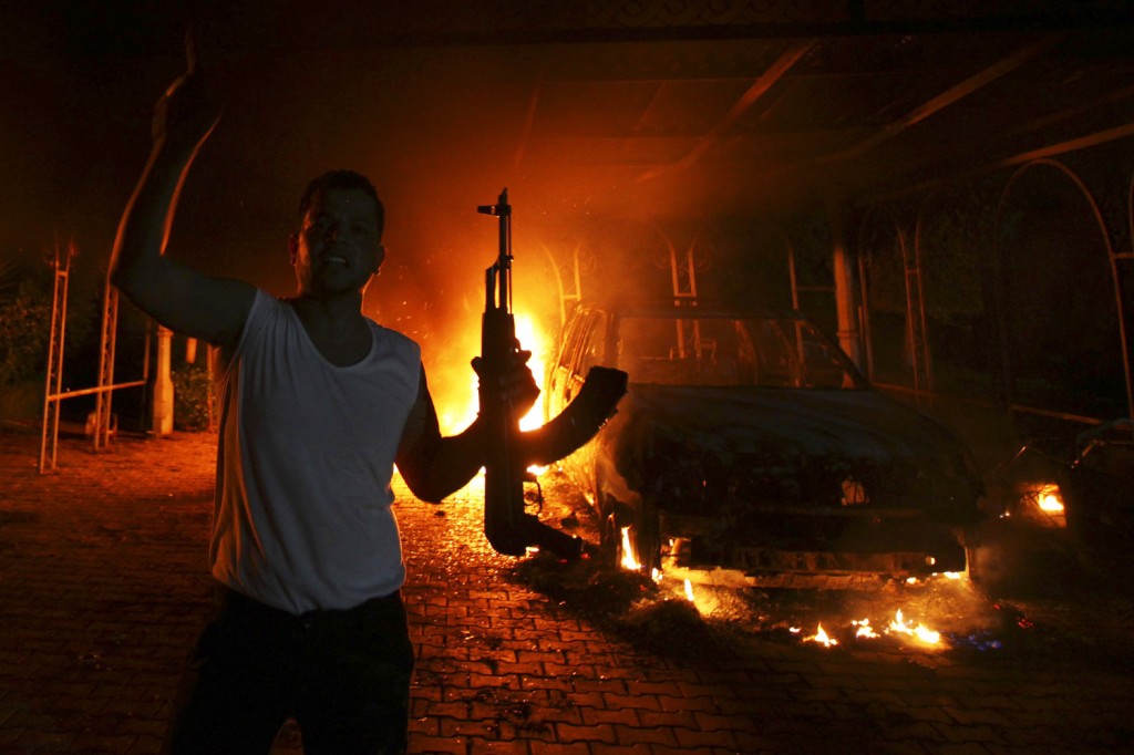 Image: A protester reacts as the U.S. Consulate in Benghazi burns