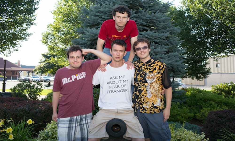 7/11/12 5:40:19 PM -- Salem, Massachusetts BU alum Noah Britton (CAS '05) with his cast members of the comedy troupe, Asperger's 'R' Us in Salem, MA.  Cast members include Noah Britton (white shirt), New Michael Ingemi (black/gold shirt), Jack Hanke (red shirt), Ethan Finlan (purple Mr. Pibb shirt) Photo by Jared Charney for Boston University Photography